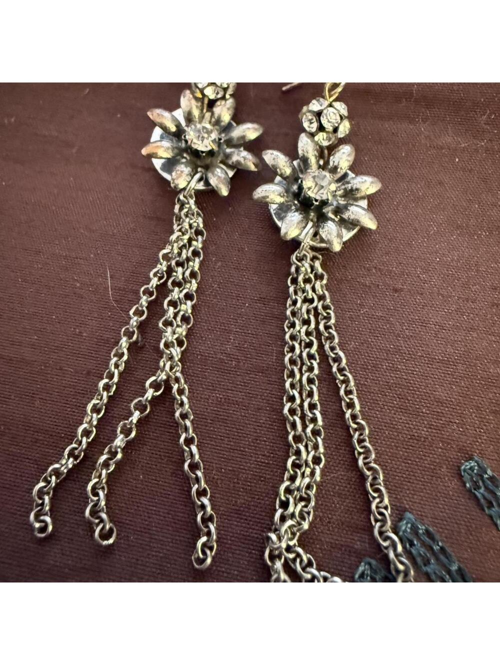 VTG-style silver flower dangle earrings W/ crystal accents & long chain tassels.